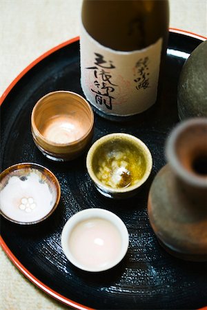 sake - Bottle of sake and sake cups on tray, close-up Stock Photo - Premium Royalty-Free, Code: 633-02417864