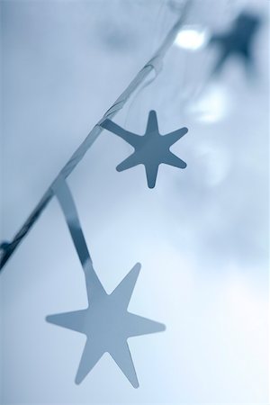 star silhouette background - Star shaped Christmas garland, close-up Stock Photo - Premium Royalty-Free, Code: 633-02418046