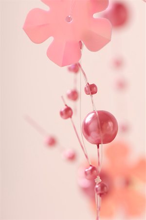 simsearch:633-02418107,k - Pink decorative garland, close-up Stock Photo - Premium Royalty-Free, Code: 633-02418059