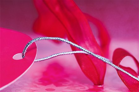 Pink gift tag and ribbon, extreme close-up Stock Photo - Premium Royalty-Free, Code: 633-02418123