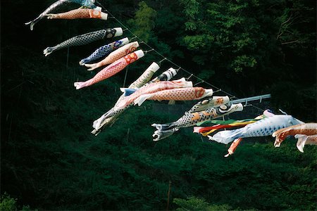 Long row of koinobori hanging, flowing in breeze Stock Photo - Premium Royalty-Free, Code: 633-02645316