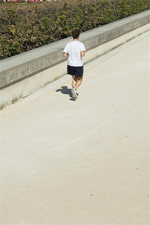 simsearch:633-01715682,k - Man jogging in park, rear view Stock Photo - Premium Royalty-Free, Code: 633-02691232