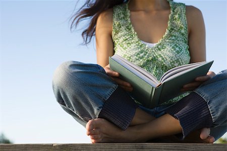 simsearch:632-03083700,k - Woman reading book outdoors, cropped Stock Photo - Premium Royalty-Free, Code: 633-03194551