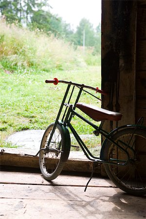 scandinavia - Child's bicycle stored in garage Stock Photo - Premium Royalty-Free, Code: 633-03444789