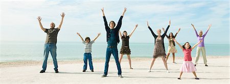 eight (quantity) - Group of people on beach with arms raised enjoying fresh sea air Stock Photo - Premium Royalty-Free, Code: 633-03444991