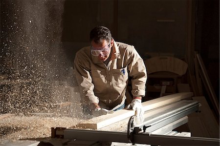 Carpenter working in workshop Stock Photo - Premium Royalty-Free, Code: 644-07809271