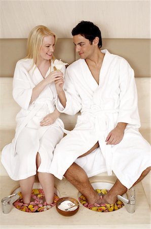 simsearch:644-01436677,k - A young couple enjoying a foot bath with rose petals Stock Photo - Premium Royalty-Free, Code: 644-01435776