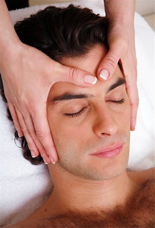 Man having facial massage Stock Photo - Premium Royalty-Free, Code: 644-01435969