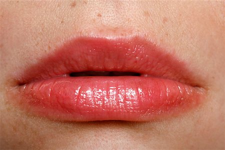 Close up of woman's mouth Stock Photo - Premium Royalty-Free, Code: 644-01435983