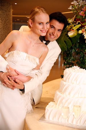 Bride and groom with cake Stock Photo - Premium Royalty-Free, Code: 644-01436156