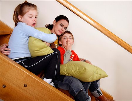 Mother with tired children on staircase Stock Photo - Premium Royalty-Free, Code: 644-01436464