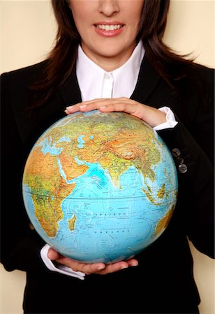 A woman holding a globe Stock Photo - Premium Royalty-Free, Code: 644-01436596