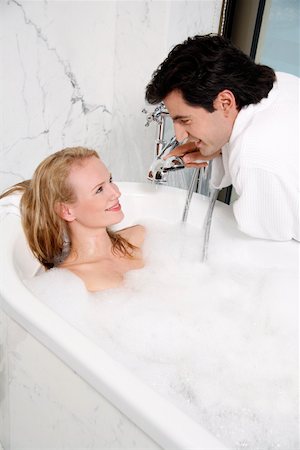 Couple enjoying bubble bath together Stock Photo - Premium Royalty-Free, Code: 644-01436788