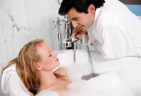 Couple enjoying bubble bath together Stock Photo - Premium Royalty-Free, Code: 644-01436789