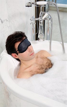 Man enjoying bubble bath Stock Photo - Premium Royalty-Free, Code: 644-01436795