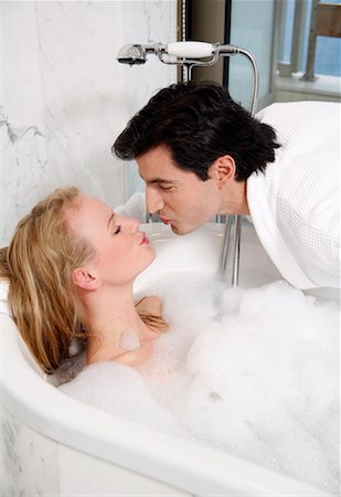 Couple enjoying bubble bath together Stock Photo - Premium Royalty-Free, Code: 644-01436790
