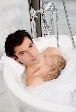 Man enjoying bubble bath Stock Photo - Premium Royalty-Free, Code: 644-01436792