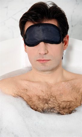 Man enjoying bubble bath Stock Photo - Premium Royalty-Free, Code: 644-01436793