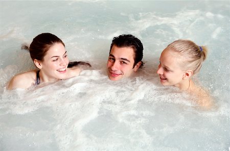 swimming class - One man with two women  in jacuzzi at a spa Stock Photo - Premium Royalty-Free, Code: 644-01436879