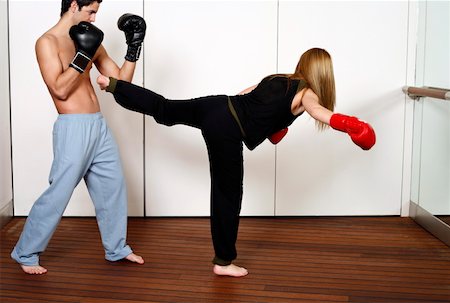 student fighting - Straight right-hand punch of Active Tae Bo and side kick Stock Photo - Premium Royalty-Free, Code: 644-01436942