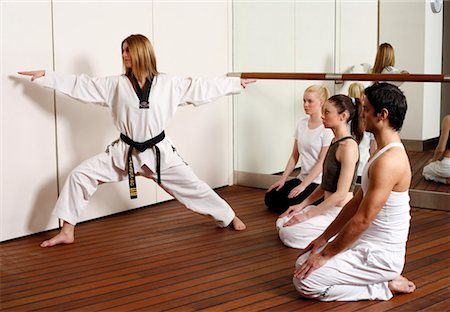 student fighting - Students observing Tae Kwon Do - Dantae demonstration Stock Photo - Premium Royalty-Free, Code: 644-01436962
