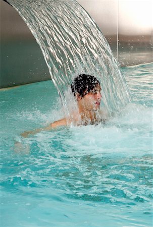 simsearch:644-01437057,k - Young man standing under water spray in spa pool Stock Photo - Premium Royalty-Free, Code: 644-01436998