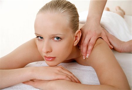 Young woman enjoying a massage Stock Photo - Premium Royalty-Free, Code: 644-01437107