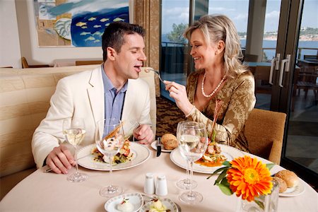 Mature couple dining in a restaurant Stock Photo - Premium Royalty-Free, Code: 644-01437312