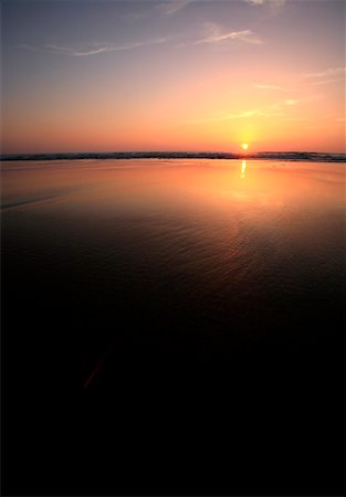 View of sunset over water Stock Photo - Premium Royalty-Free, Code: 644-01437414