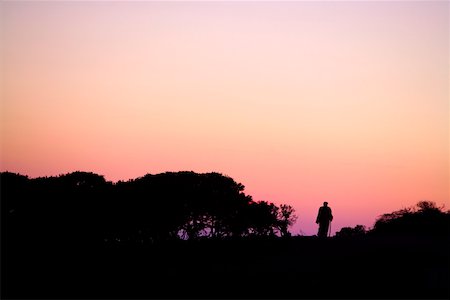 simsearch:644-01630775,k - Silhouette of person standing in sunset landscape Stock Photo - Premium Royalty-Free, Code: 644-01437416