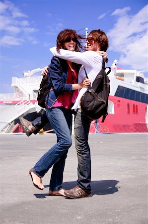 friends hello - Young couple at ferry dock Stock Photo - Premium Royalty-Free, Code: 644-01437481