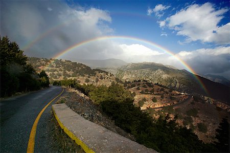 Rainbow on countryside road Stock Photo - Premium Royalty-Free, Code: 644-01630807