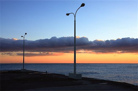 simsearch:644-01630775,k - Lamp posts in front of sunset sky Stock Photo - Premium Royalty-Free, Code: 644-01630809