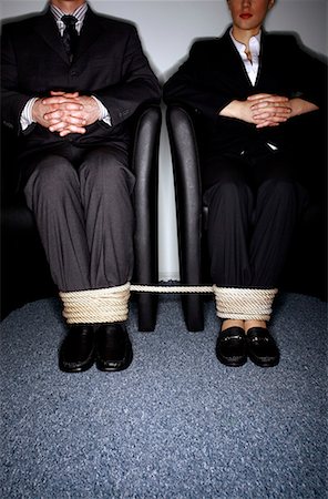 rope tied together - Male and female business people's legs tied Stock Photo - Premium Royalty-Free, Code: 644-01630947