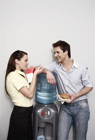 Male and female office workers eating take out food Stock Photo - Premium Royalty-Free, Code: 644-01825291