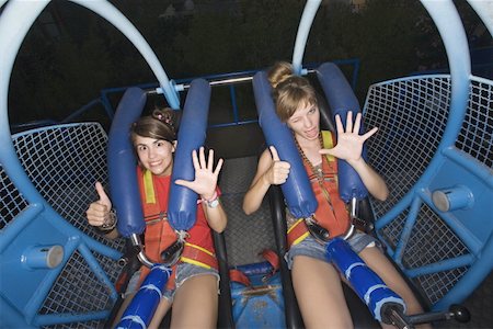 simsearch:644-02152735,k - Two female teenagers on amusement park ride Stock Photo - Premium Royalty-Free, Code: 644-01825544