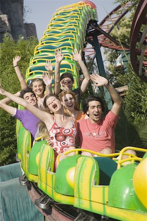 people riding roller coasters - Teenagers on amusement park ride Foto de stock - Sin royalties Premium, Código: 644-01825595