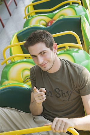 rollercoaster teenagers - Male teenager posing on amusement park ride Stock Photo - Premium Royalty-Free, Code: 644-01825592