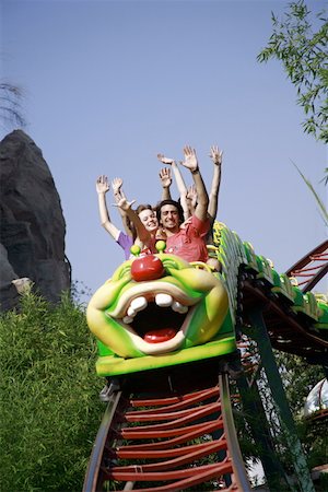 people riding roller coasters - Teenagers on amusement park ride Foto de stock - Sin royalties Premium, Código: 644-01825727