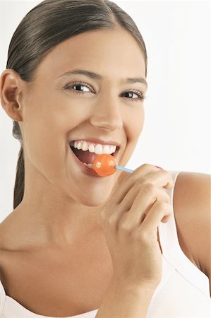 simsearch:644-02153088,k - Female young adult eating a lollipop Stock Photo - Premium Royalty-Free, Code: 644-02152685