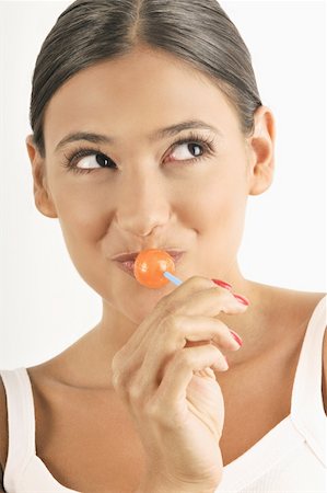 simsearch:644-02153053,k - Female young adult eating a lollipop Foto de stock - Sin royalties Premium, Código: 644-02152687