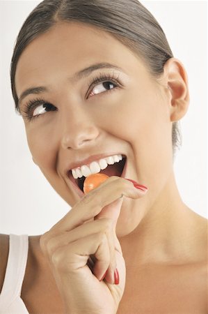 simsearch:644-02153088,k - Female young adult eating a lollipop Stock Photo - Premium Royalty-Free, Code: 644-02152689