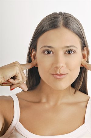 simsearch:644-02152735,k - Female young adult;plugging ears with fingers Stock Photo - Premium Royalty-Free, Code: 644-02152715