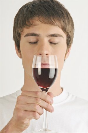 simsearch:644-02153088,k - Young male adult smelling a glass of red wine Stock Photo - Premium Royalty-Free, Code: 644-02152846