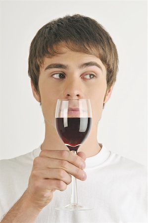 simsearch:644-02153088,k - Young male adult smelling a glass of red wine Stock Photo - Premium Royalty-Free, Code: 644-02152847