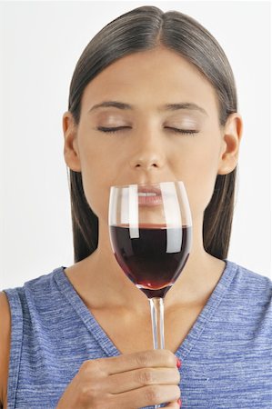 simsearch:644-02153088,k - Female young adult smelling a glass of red wine Stock Photo - Premium Royalty-Free, Code: 644-02152876