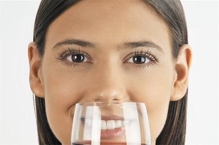 simsearch:644-02153088,k - Female young adult smelling a glass of red wine Stock Photo - Premium Royalty-Free, Code: 644-02152879