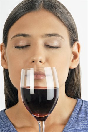simsearch:644-02153088,k - Female young adult smelling a glass of red wine Stock Photo - Premium Royalty-Free, Code: 644-02152881