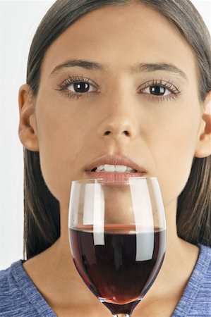 simsearch:644-02153088,k - Female young adult smelling a glass of red wine Stock Photo - Premium Royalty-Free, Code: 644-02152882