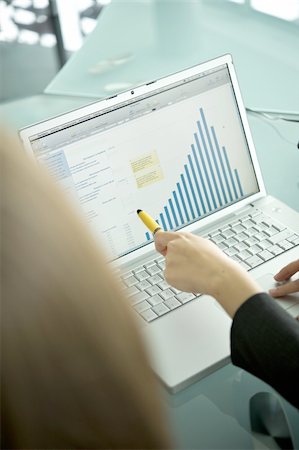 financial graphs and charts - Businesswoman's hands with laptop showing bar chart Stock Photo - Premium Royalty-Free, Code: 644-02923227